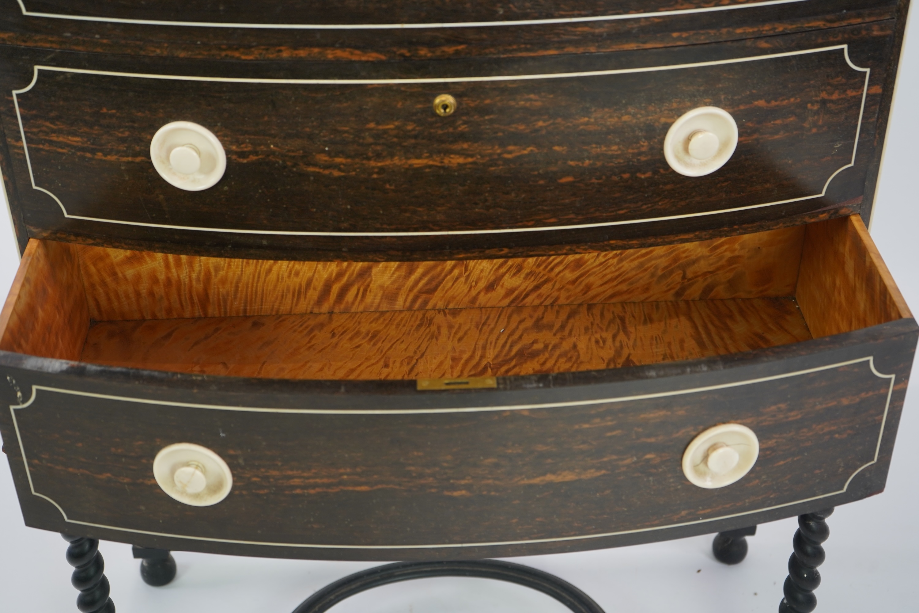 An early 20th century ivory mounted coromandel three drawer bowfront chest, stamped Callow of Mount Street, London